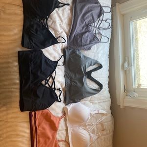 Whole lot of sports bras. Strappy bra and bralettes